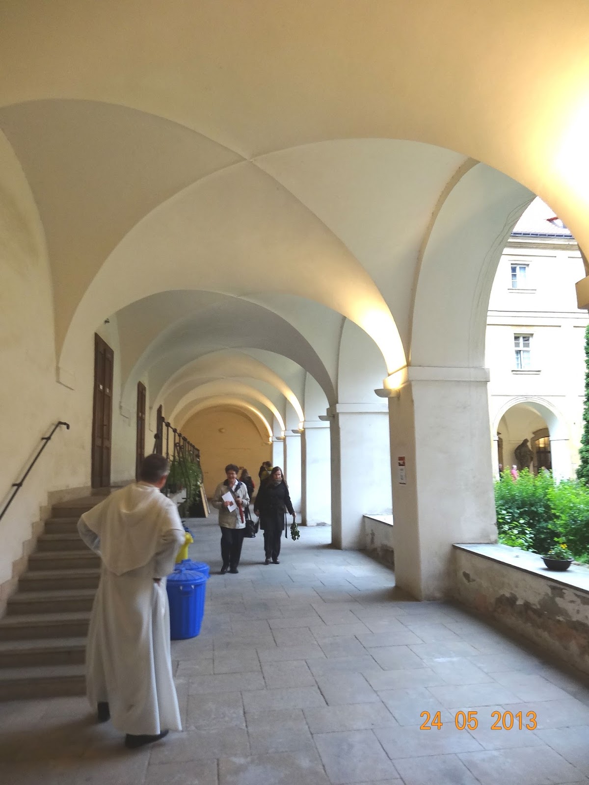 A member of the Dominican order welcomes visitors of "Night of churches" in the cloister  of Monastery